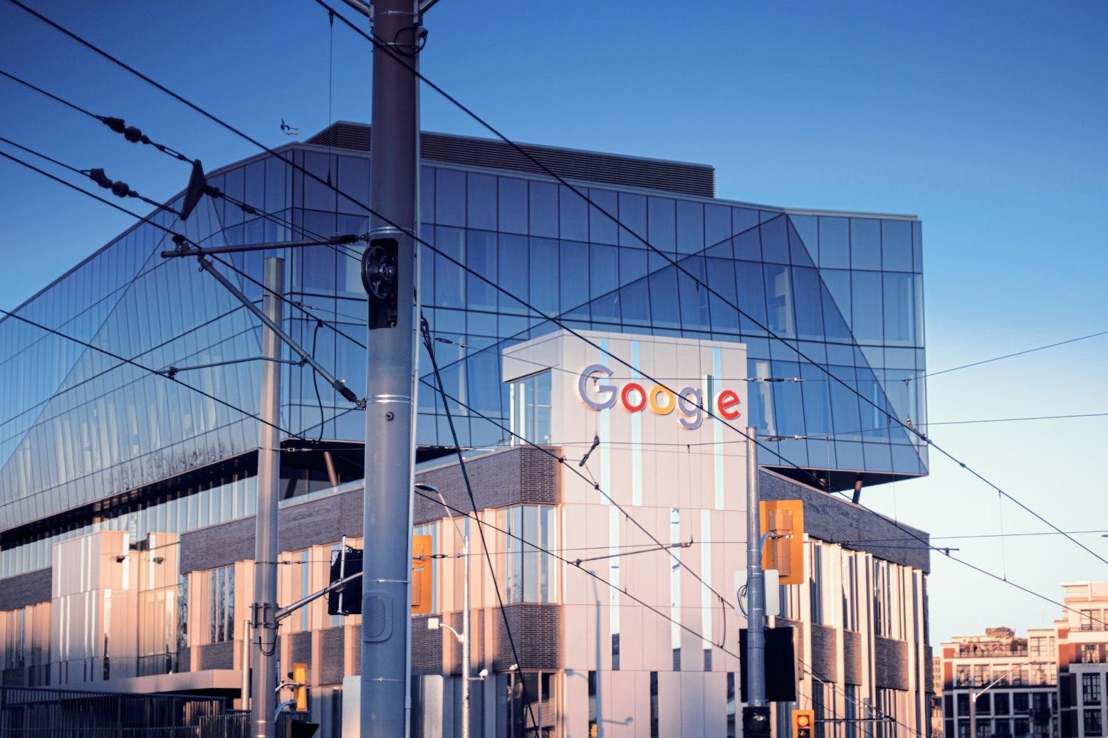 The image shows a building with a Google logo on the facade.